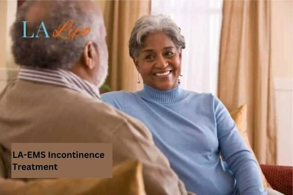 Couple sat smiling at each other - LA-EMS treatment Birmingham